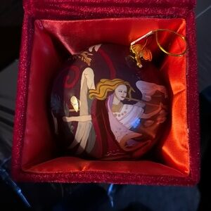 Avon glass ornament with angels. Comes with lined box to protect.